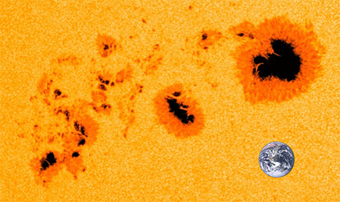 Región de manchas solares 11944 a un tamaño de 1480MH según lo visto por el Observatorio de Dinámica Solar. La Tierra ha sido agregada por escala.