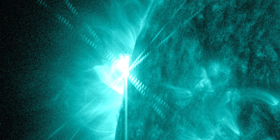 M2.1 and M1.4 solar flares from a sunspot region behind the limb
